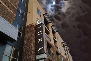 Aura Memorial Apartments LED Illuminated Identity Blade Sign on Building Night