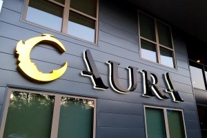 Aura Memorial Apartments Identity LED Halo Lit Letters by Leasing Office Night