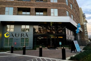 Aura Memorial Apartments LED Illuminated Identity Blade and Halo Lit Letters by Leasing Office Night