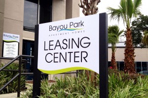 Bayou Park Apartment Homes Leasing ID with Hours Sign