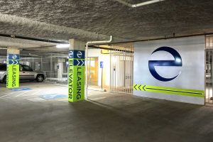 Echo City Apartments Illuminated Icon in Garage and Painted Columns Directional