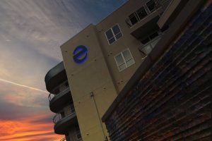 Echo Identity Sign Illuminated Icon on Building Night