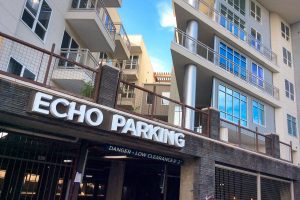 Echo City Apartments Illuminated Echo Parking Letters at Entrance of Garage