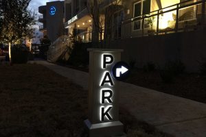 Echo City Apartments Illuminated Parking Directional Night