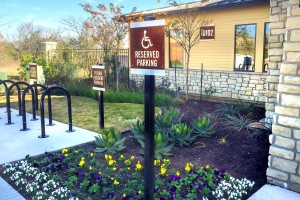Dalian Monterrey Village Apartments Corten Steel Handicap and Future Resident Parking Signs on Post