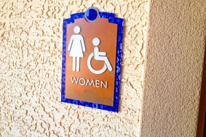 Indigo Apartments Women Restroom Sign with ADA/Braille