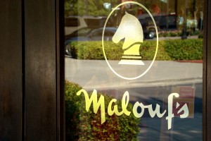 Malouf's Fine Men's and Women's Apparel Door Vinyl Gold Mirror