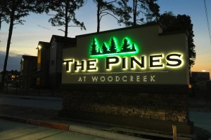 The Pines at Woodcreek Apartments LED Illuminated Monument on Masonry Base Night