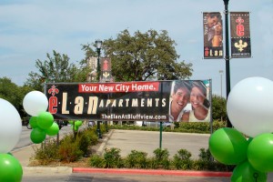 Elan at Bluffview Apartments Marketing Banner with Balloons on a Stick