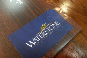 WaterStone at Carriage Trails Apartments - Business Card in Slit