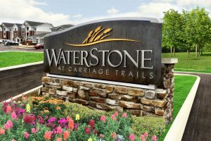 WaterStone at Carriage Trails Apartments - Contemporary Identity Monument with Brushed Aluminum Letters on Corten Steel for Rusted Design