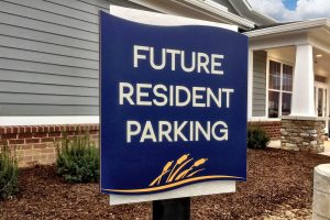 WaterStone at Carriage Trails Apartments - Future Resident Parking with DiBond Backer and High-Pressure Laminate on Post