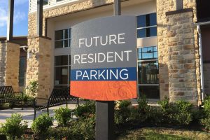 Villas on the Hill Apartments - Colorful Future Resident Parking Sign on Post
