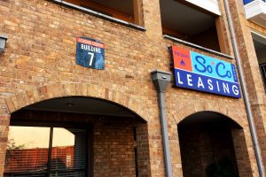 The Davis Soco Apartments Leasing Center Wall Sign with Building Number