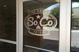The Davis Soco Apartments Leasing Center Door Vinyl Logo