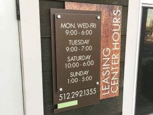 Brezza Natural Living Apartments | Leasing Hours Signage