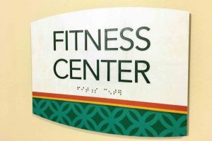 The Alden South Hills Apartments Fitness Center ID with Braille