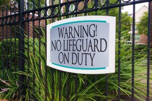 The Grand on Memorial Apartments Warning No Lifeguard Sign